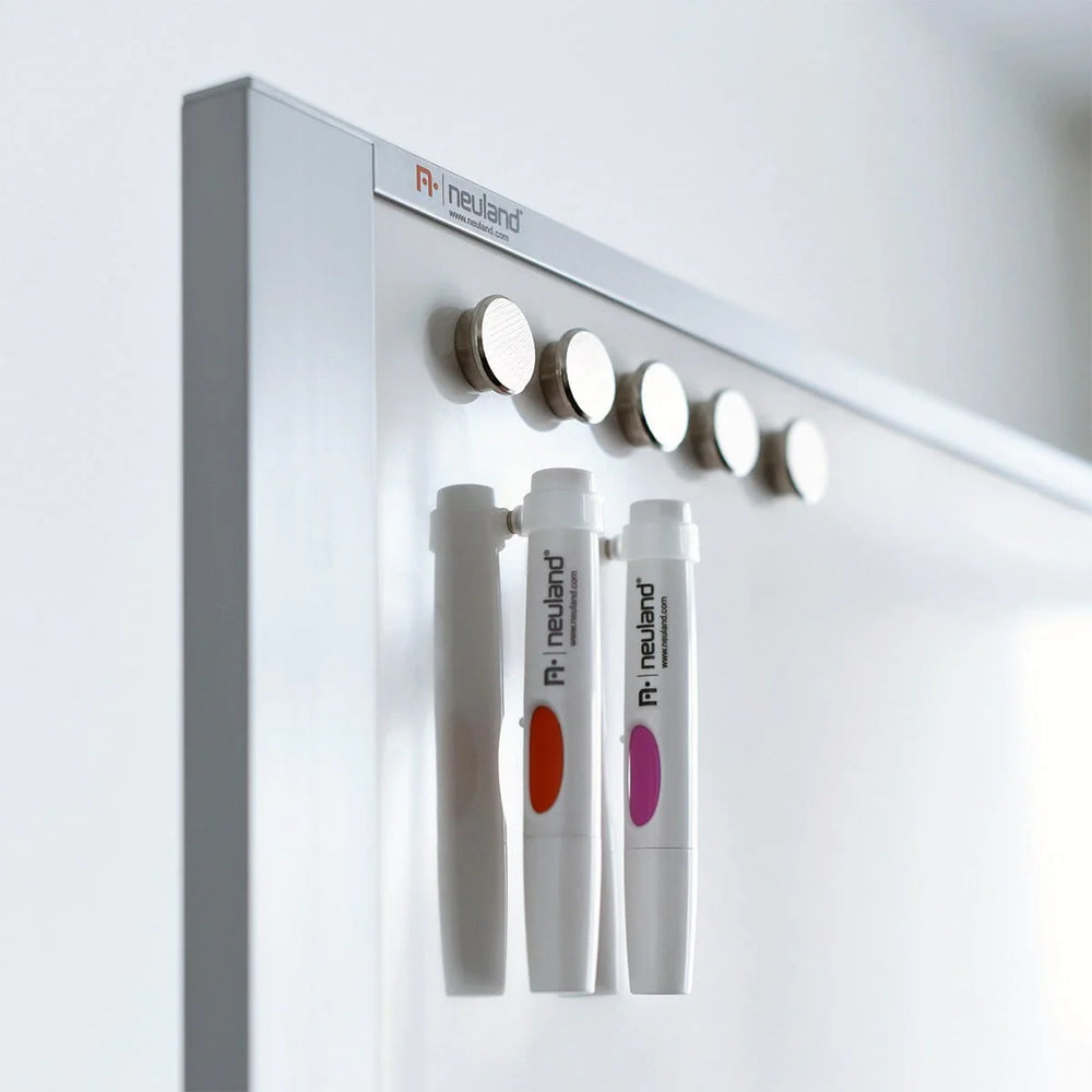Neuland magnetic marker holder on whiteboard in meeting room. Made to fit Neuland No.One marker pen. Sold in the UK by Inky Thinking Shop, official Neuland reseller.