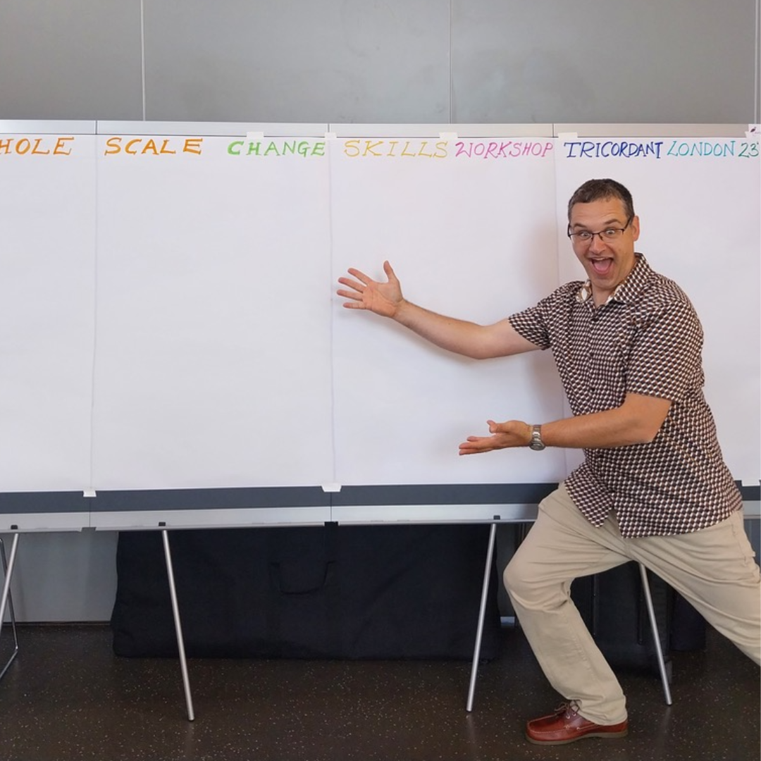 Photo of Ralph Mann in meeting room posing next to Neuland LW-X GraphicWall