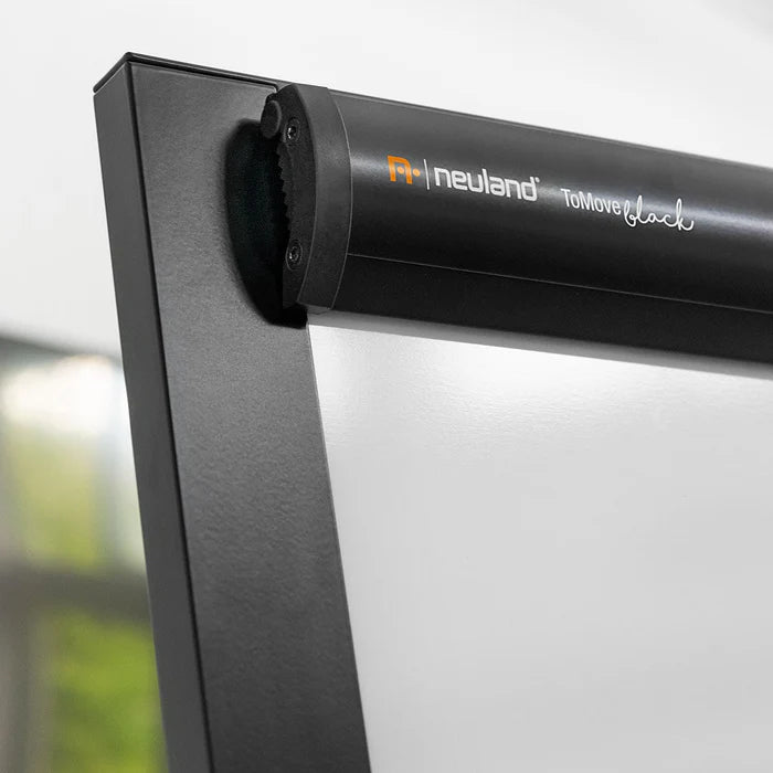 Neuland ToMove FlipChart is a sophisticated flipchart featuring an elegant tripod castor frame and a magnetic whiteboard surface. Offered in either a stylish matte black or a refined grey aluminium finish. Sold in UK by Inky Thinking