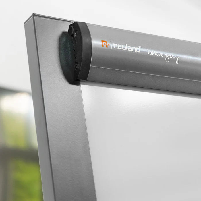Neuland ToMove FlipChart is a sophisticated flipchart featuring an elegant tripod castor frame and a magnetic whiteboard surface. Offered in either a stylish matte black or a refined grey aluminium finish. Sold in UK by Inky Thinking