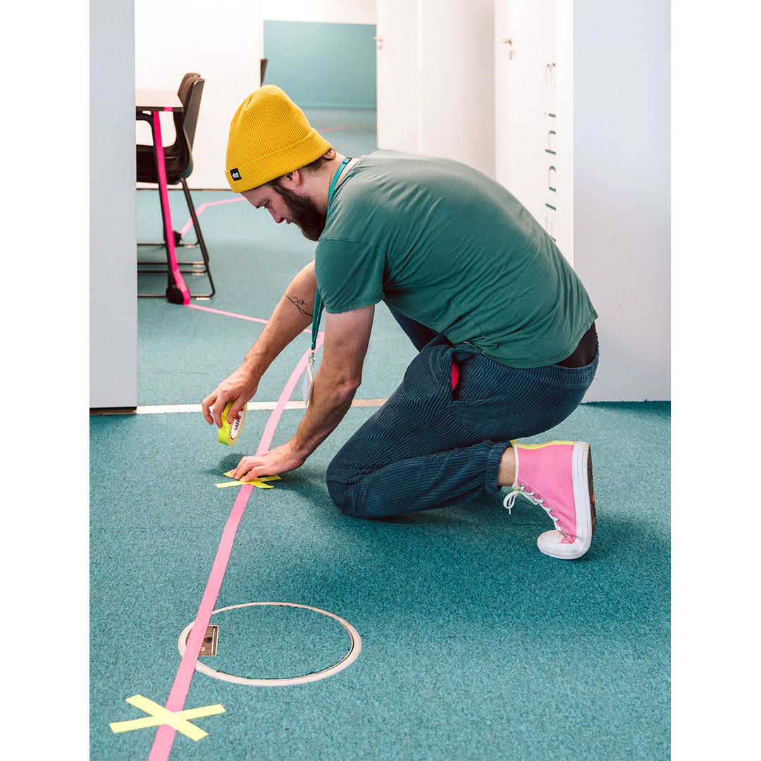 Neuland Floor Tape, pink and yellow lines taped to office floor. Tape  for art projects, meeting facilitation, graphic illustrations. Sold in UK via Inky Thinking GB Shop. Official Reseller. 