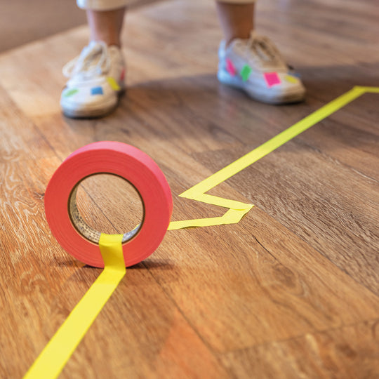 Neuland Floor Tape, pink and yellow lines taped to office floor. Tape  for art projects, meeting facilitation, graphic illustrations. Sold in UK via Inky Thinking GB Shop. Official Reseller. 