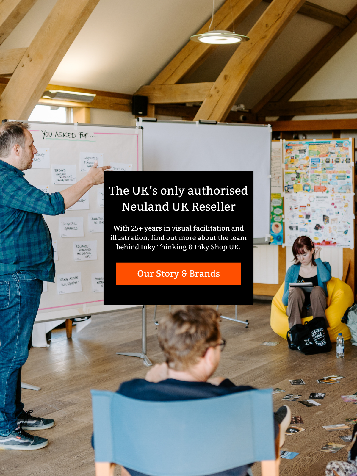 A group of Inky Thinking illustrators gathered in a meeting room  with one man writing on a whiteboard and others listening. A black promotional overlay for 'Neuland UK Reseller' is superimposed on the right side of the image.